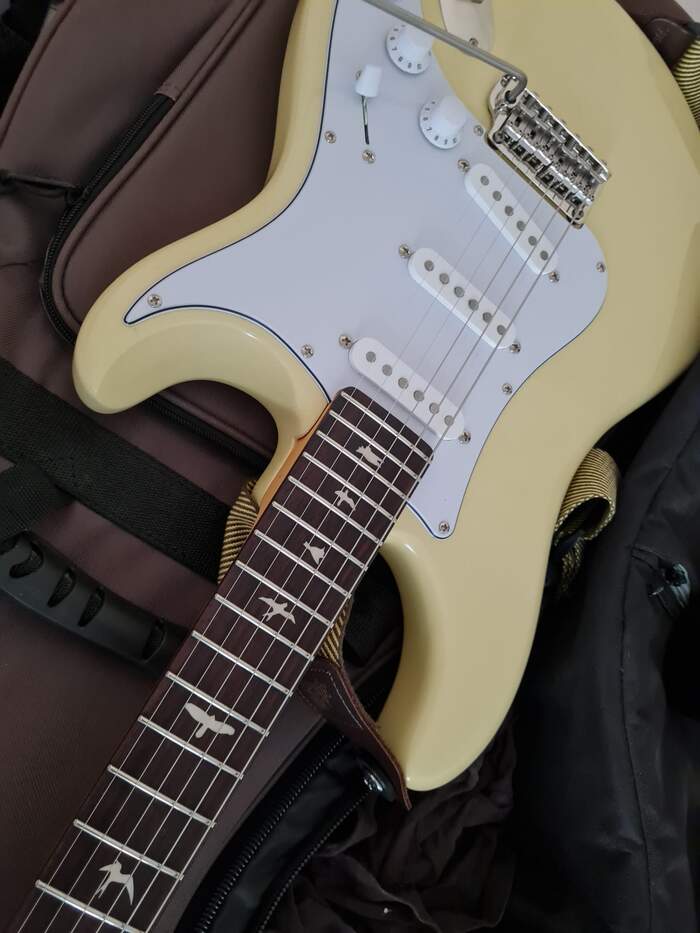 Cream Fender Stratocaster with bird inlay fretboard, ready for setup